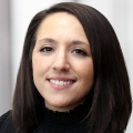 female in black shirt smiling headshot