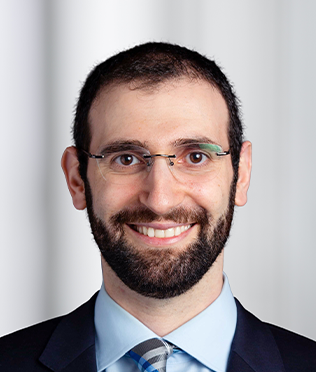 Male with glasses smiling headshot