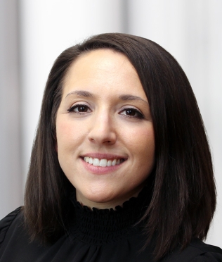 female in black shirt smiling headshot