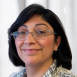 woman with glasses smiling headshot